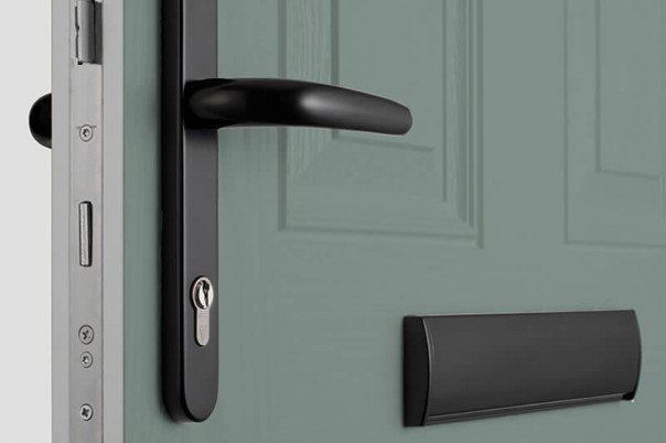 Modern composite door with black handle and letterbox