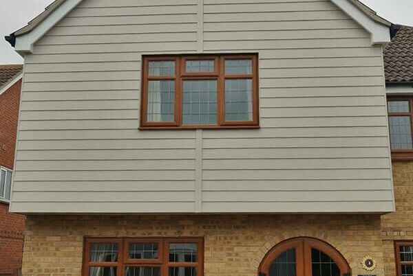 12 windows, 4 doors, replacement UPVC fascia and soffit board and Hardie plank cladding